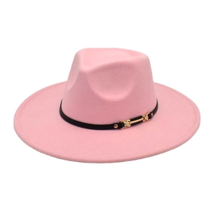 Detail of pink wool fedora hat with wide brim, black band and gold metal buckle