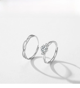 Close-up of S925 sterling silver Mobius couple rings with sparkling zircon inlay