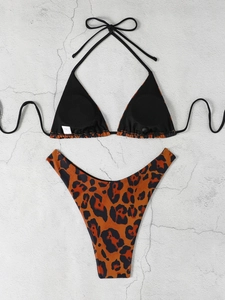 Detailed flat lay of leopard print triangle bikini set with adjustable halter neck ties