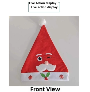 Detailed view of plush Santa hat featuring snowflake patterns and a cartoon face