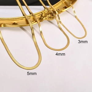 Detailed comparison of 3mm, 4mm and 5mm gold snake chain necklaces on a vintage frame