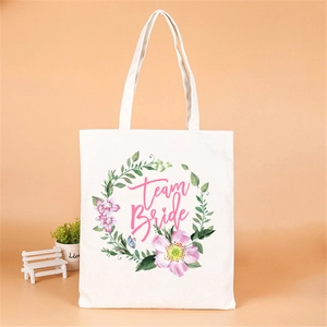 White canvas Team Bride tote bag with pink floral design for wedding parties