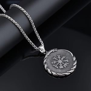 Macro detail of Nordic Viking compass pendant with black vintage oxidation finish