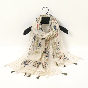 Floral cotton linen beach shawl in beige with blue and red flower prints and tassels
