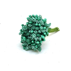 Detail of teal green artificial flower buds on wire stems for DIY floral crafts