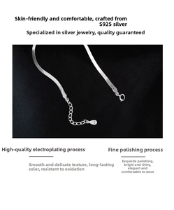 Macro detail of S925 sterling silver snake chain with lobster clasp and extension