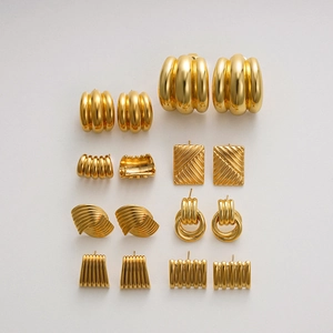 Detailed close-up of 18K gold textured stud earrings collection in diverse geometric shapes
