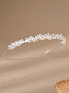 Detail of handmade silver hairband with cluster crystal beads and pearls for brides