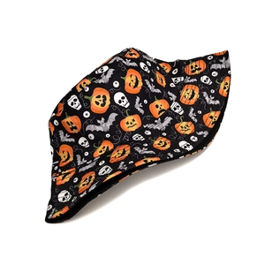 Halloween bucket hat with orange Jack-o'-lantern and white skull prints on black fabric