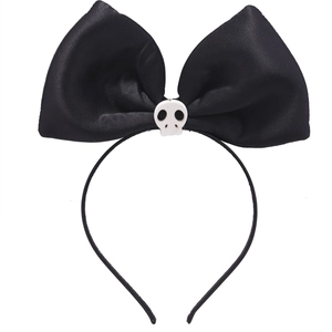 Detail of black headband featuring large satin bow with small white skull for Halloween