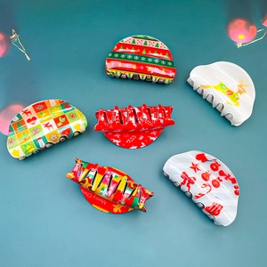 Set of 6 festive PVC Christmas hair claws with reindeer and gingerbread man patterns