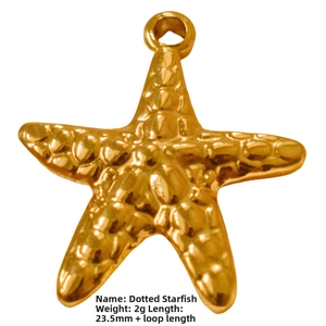 Detailed view of a golden dotted starfish pendant measuring 23.5mm and weighing 2g