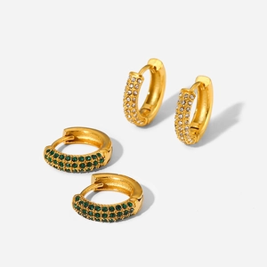 Close-up of 18K gold plated hoop earrings with white and green zircon inlay on white background