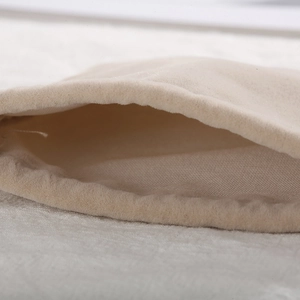 Minimalist beige microfiber drawstring jewelry pouch with soft velvet texture