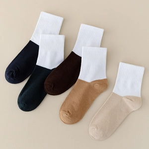 Detail of 5-pack multicolored cotton crew socks for kids with ribbed white cuffs