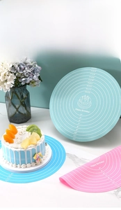 Detail of round silicone baking mat with precise scale measurements and birthday design