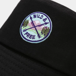 Japanese style black cotton bucket hat with Wild and Free mountain embroidery patch