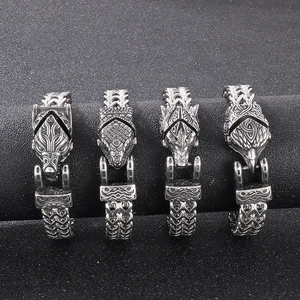 Viking style steel bracelets featuring wolf, eagle, and snake heads on braided chains