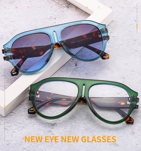 Detail view of large aviator sunglasses with gradient lenses and tortoiseshell temples