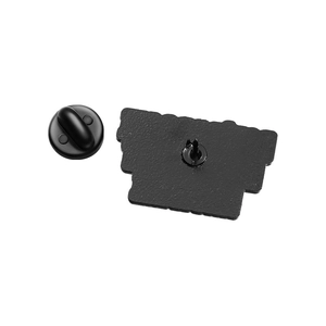 Detail view of the black metal badge back pin and rubber clutch on a white background