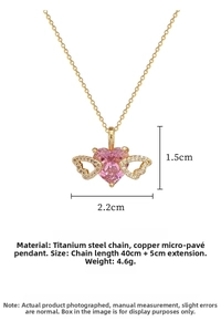 Detail view of heart wing necklace with pink gemstone and 40cm stainless steel chain