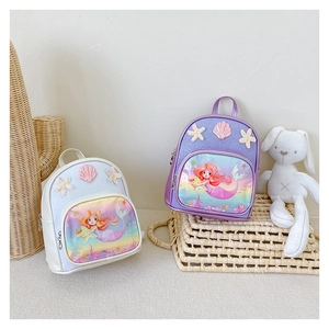 Detail of mermaid backpacks with glitter finish, starfish and shell decorations