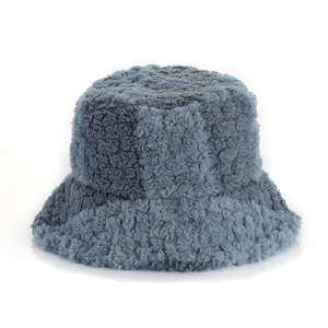 Winter faux fur bucket hat for women in blue with subtle checkerboard plush texture