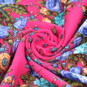 Macro shot of 90x90 ethnic floral scarf fabric showing detailed woven texture and patterns