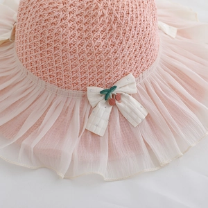 Pink kids straw sun hat with chiffon brim and cherry bow detail for princess style