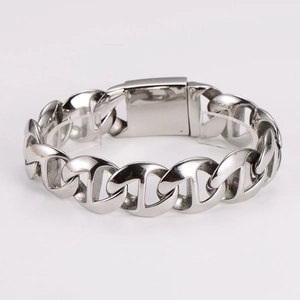 Macro detail of polished stainless steel anchor link bracelet with stylish clasp
