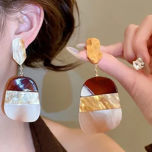 Three-tier geometric acetate drop earrings in tortoiseshell brown and cream colors