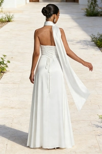 Detail of white satin backless maxi dress with cross-tie straps and elegant long scarf