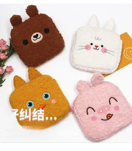 Detailed view of plush animal-themed sanitary pouches with embroidery and zip closure