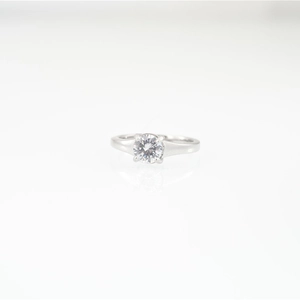 Elegant titanium steel wedding ring with round brilliant cut moissanite in 4-prong setting