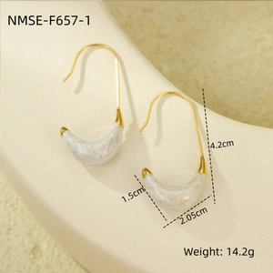Detail view of gold C-shaped earrings with white marble texture including size measurements