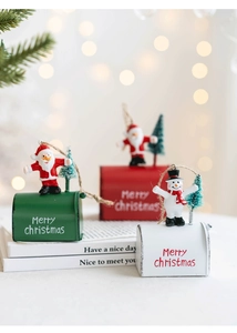 Detailed view of red, white, and green Christmas mailbox ornaments with Santa and Snowman