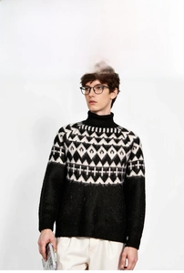 Close-up of geometric jacquard texture and 5-needle 14-count knit fabric on men's sweater