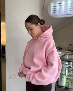 Detailed close-up of pink oversized hoodie showing premium heavy cotton fabric texture