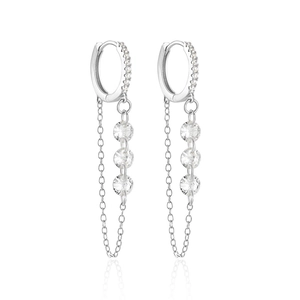 Detail of 925 sterling silver hoop earrings with shimmering crystal tassels and chain