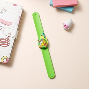 Detail of green silicone slap watch featuring a 3D cute cartoon dinosaur for children