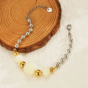 Detailed view of stainless steel beaded bracelet featuring gold, silver, and textured beads
