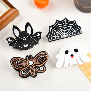 Set of 4 Halloween hair claws with black bat, white ghost, spider web, and skull patterns