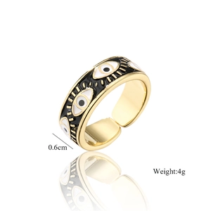 Detail shot of golden evil eye ring with black and white enamel, 0.6cm width and 4g weight