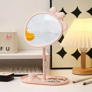 Pink bow desktop makeup mirror with rotating round glass and jewelry storage base tray