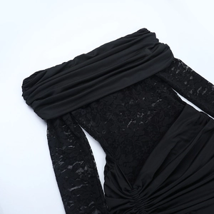 Detail of off-the-shoulder black lace dress with slim fit and ruched pleating details