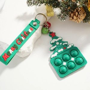 Christmas tree silicone fidget toy keychain with green bubbles and festive pine decor