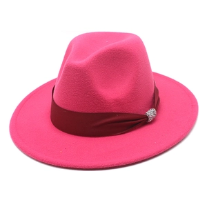 Detail of hot pink wool fedora featuring a silk band and sparkling rhinestone buckle