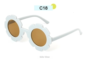 Side view of matte light blue flower-shaped children's sunglasses with brown lenses