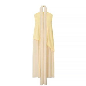 Detail of light yellow and cream beige tube dress featuring long flowing streamers