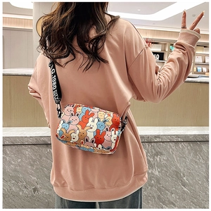 Detailed view of the cute cartoon rabbit print shoulder bag showing stylish strap details.